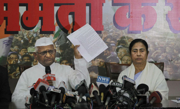 Anti-corruption activist Anna Hazare displays his 17-point agenda as he addresses a joint press conference with West Bengal Chief Minister Mamata Banerjee in New Delhi on Wednesday - PTI Anti-corruption activist Anna Hazare displays his 17-point agenda as he addresses a joint press conference with West Bengal Chief Minister Mamata Banerjee in New Delhi on Wednesday - PTI
